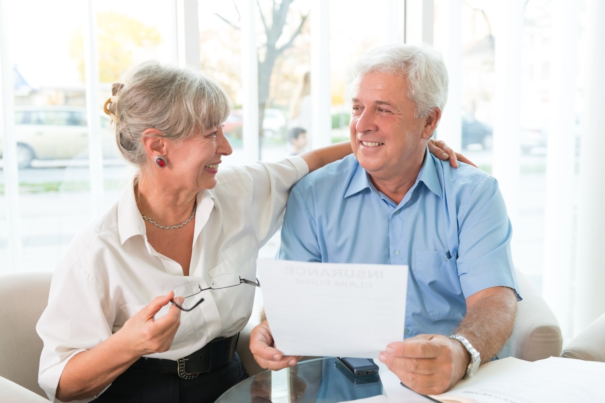 Elderly couple purchasing life insurance